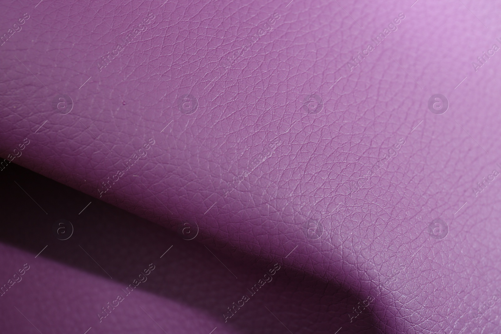 Photo of Beautiful purple leather as background, above view