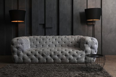 Big comfortable sofa in modern living room. Luxury interior design