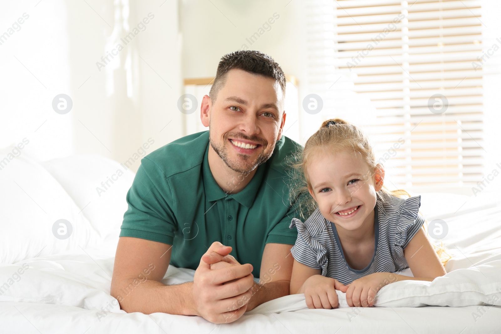 Photo of Dad and daughter spending time together at home. Happy Father's Day