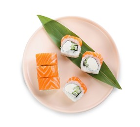 Tasty sushi rolls with green leaf on white background, top view