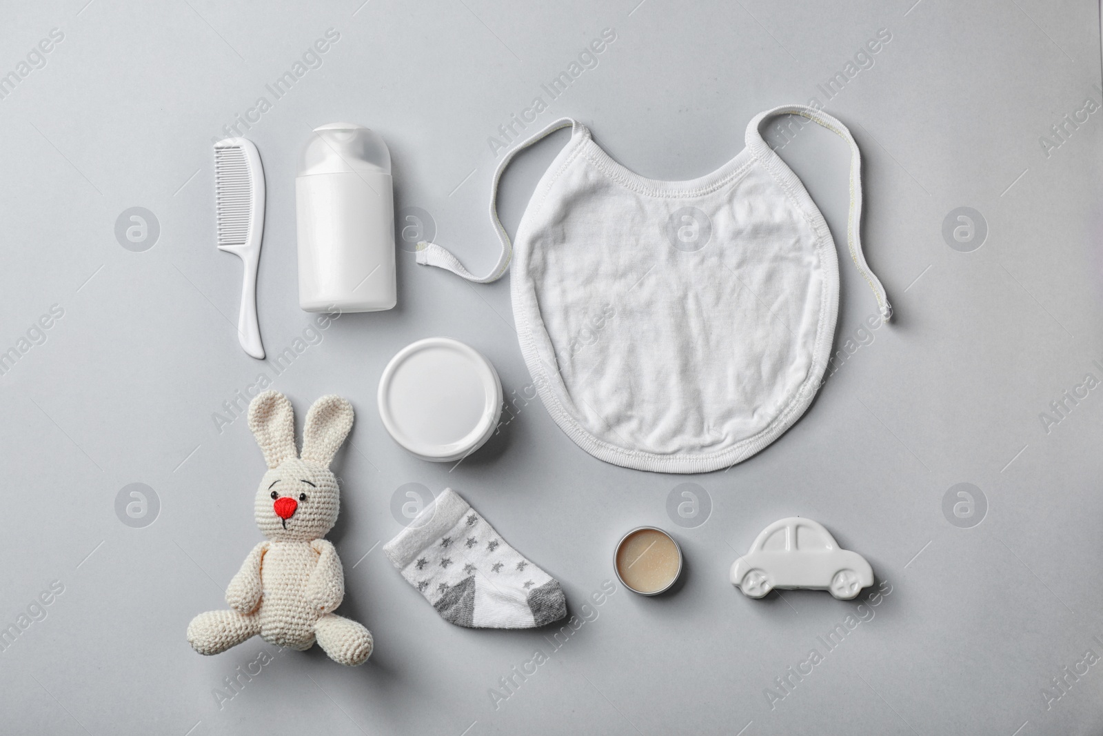 Photo of Flat lay composition with baby accessories on gray background