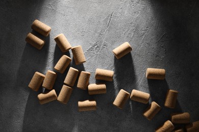 Photo of Wine bottle corks on grey table, flat lay