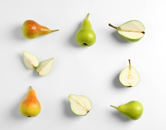 Photo of Fresh pears on light background, flat lay composition