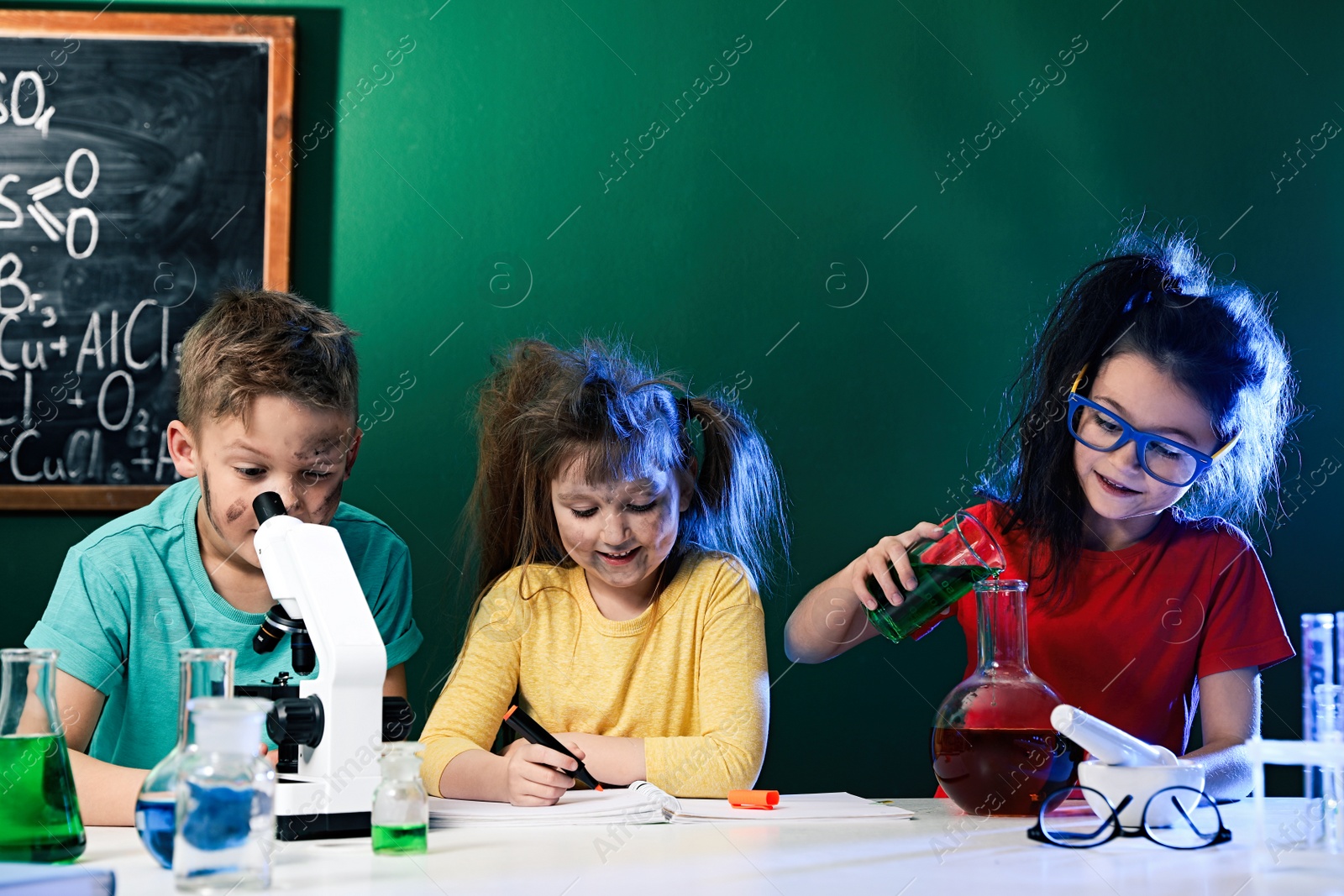 Photo of Children doing chemical research in laboratory. Dangerous experiment