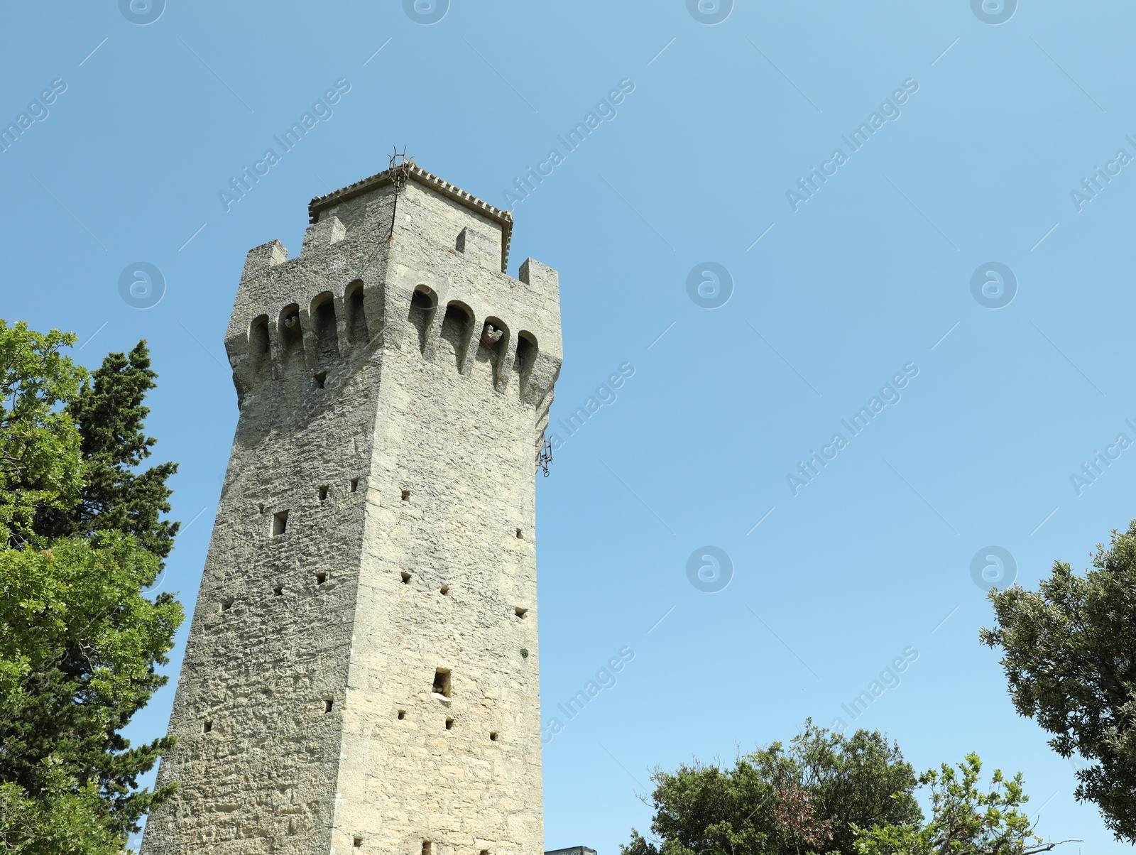 Photo of Picturesque view of tower outdoors on sunny day, space for text