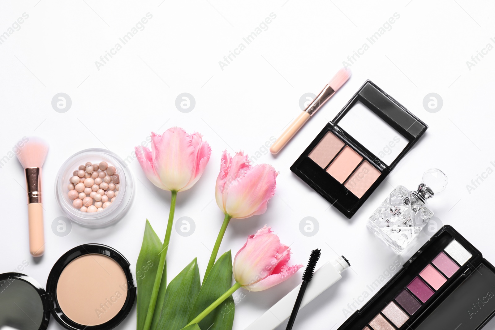 Photo of Flat lay composition with different makeup products and beautiful spring flowers on white background