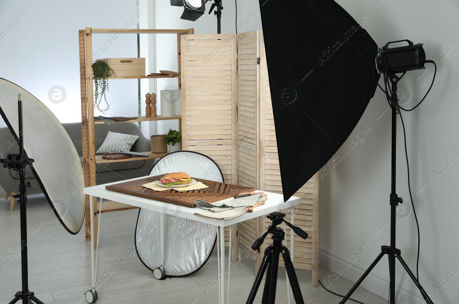 Photo of Tasty sandwich on table in photo studio. Food photography