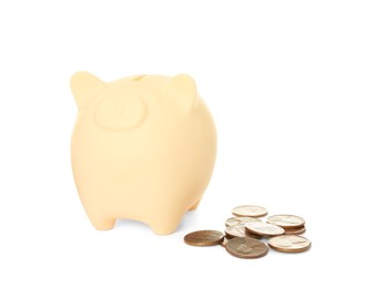 Piggy bank and coins on white background