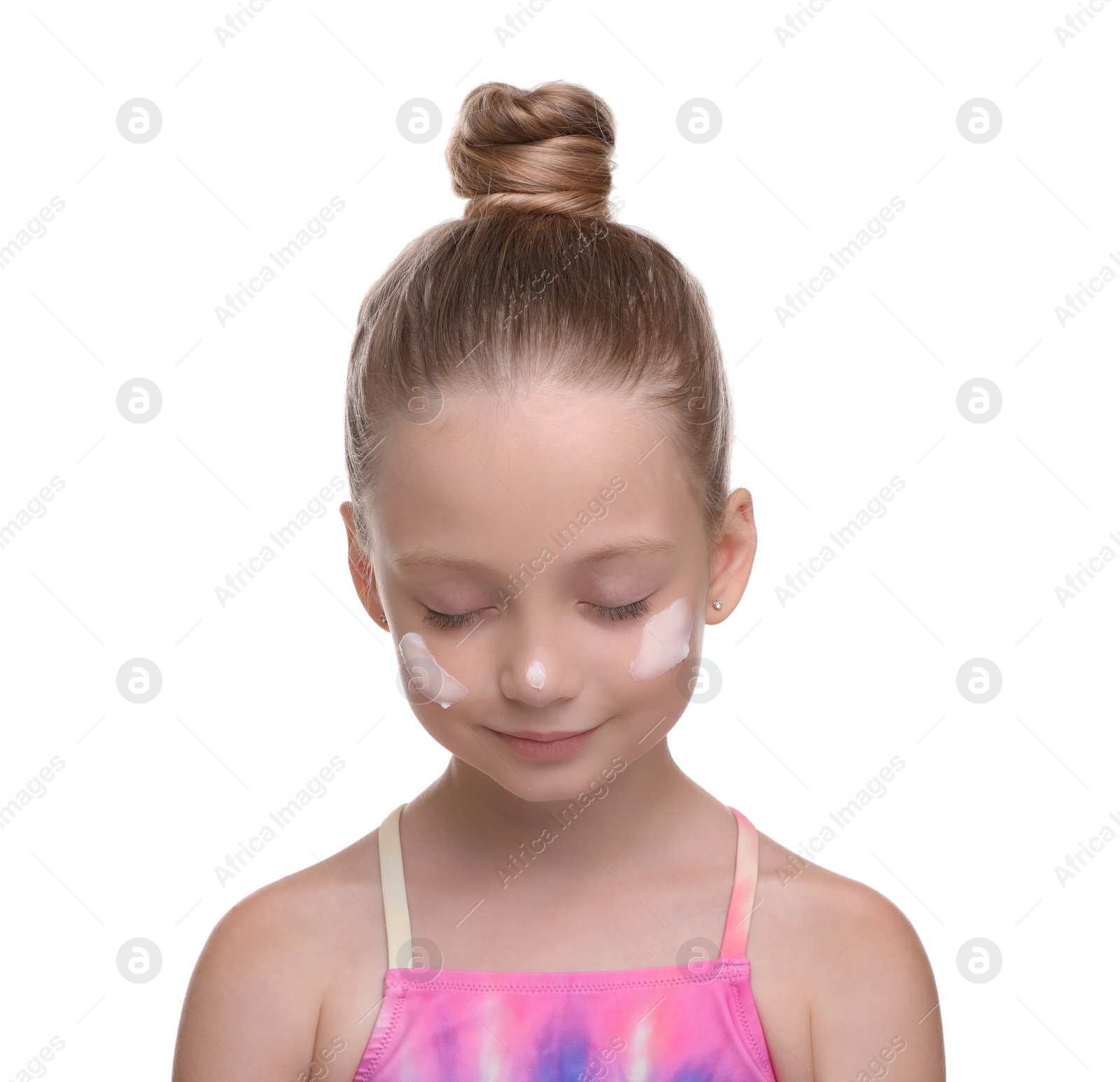 Photo of Happy girl with sun protection cream on her face isolated on white