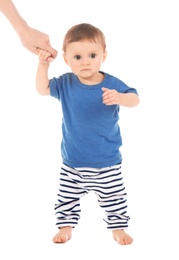 Photo of Woman holding her baby's hand on white background. Learning to walk