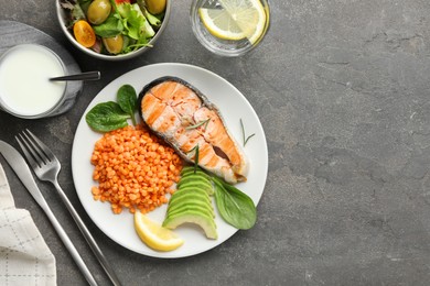 Healthy food high in vegetable fats served on grey textured table, flat lay. Space for text