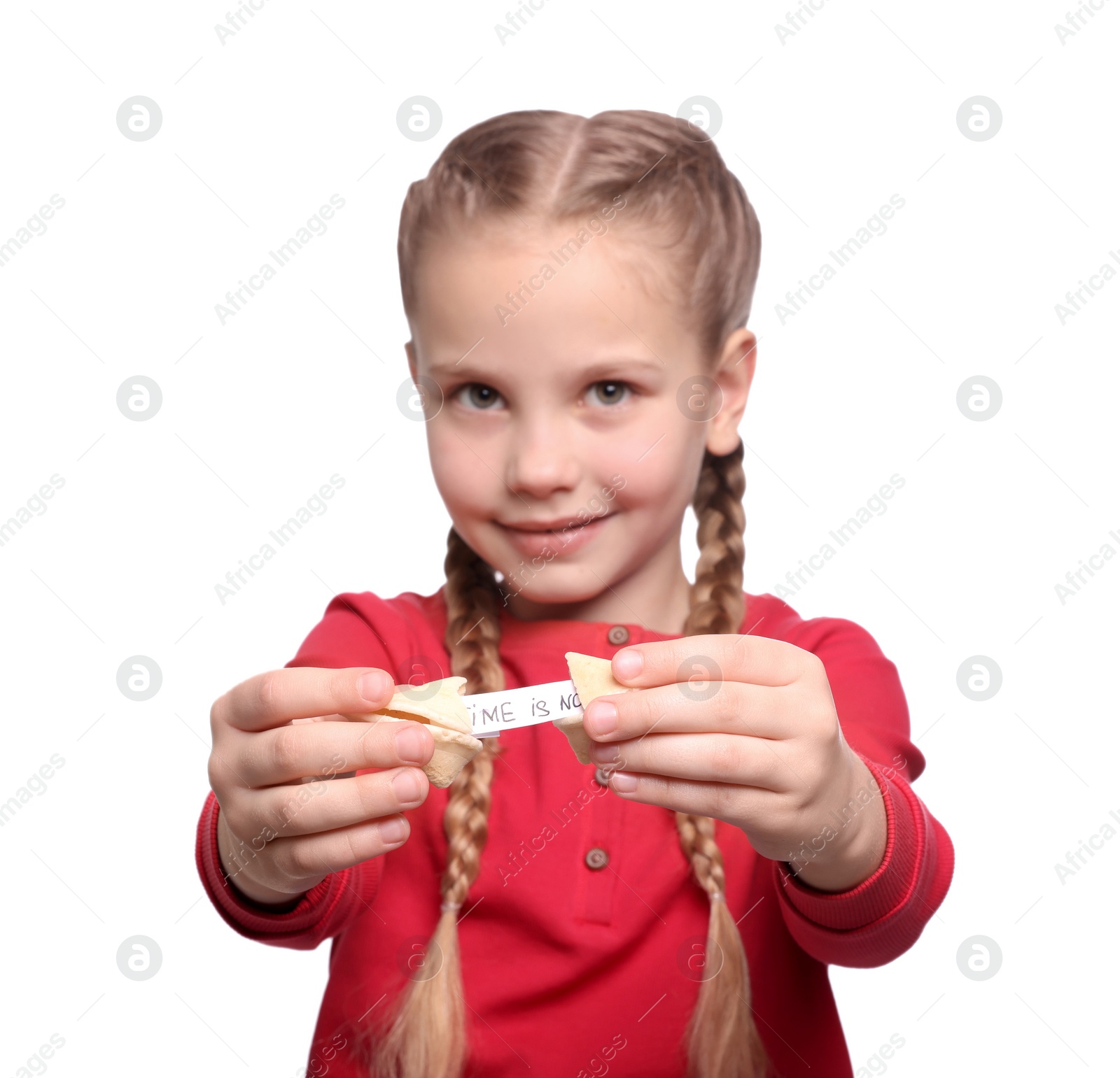 Photo of Cute girl holding tasty fortune cookie with prediction on white background