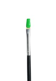 Photo of Brush with green paint isolated on white