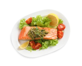 Tasty cooked salmon with pesto sauce and fresh salad on white background, top view