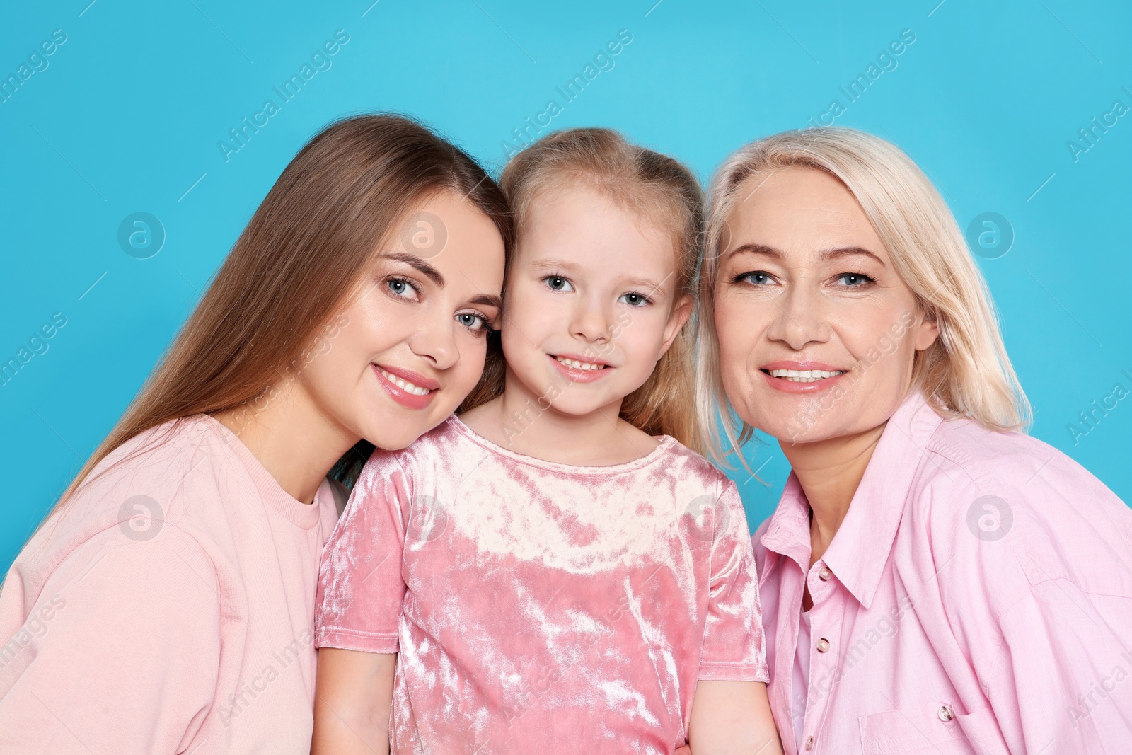 Photo of Portrait of young woman, her daughter and mature mother on color background