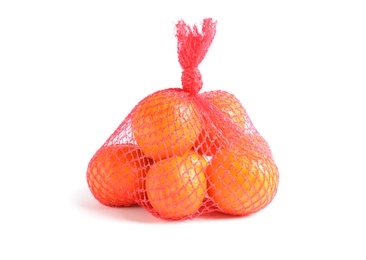 Photo of Mesh bag with tangerines on white background