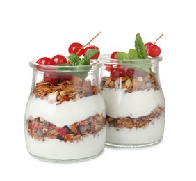 Photo of Delicious yogurt parfait with fresh red currants and mint on white background