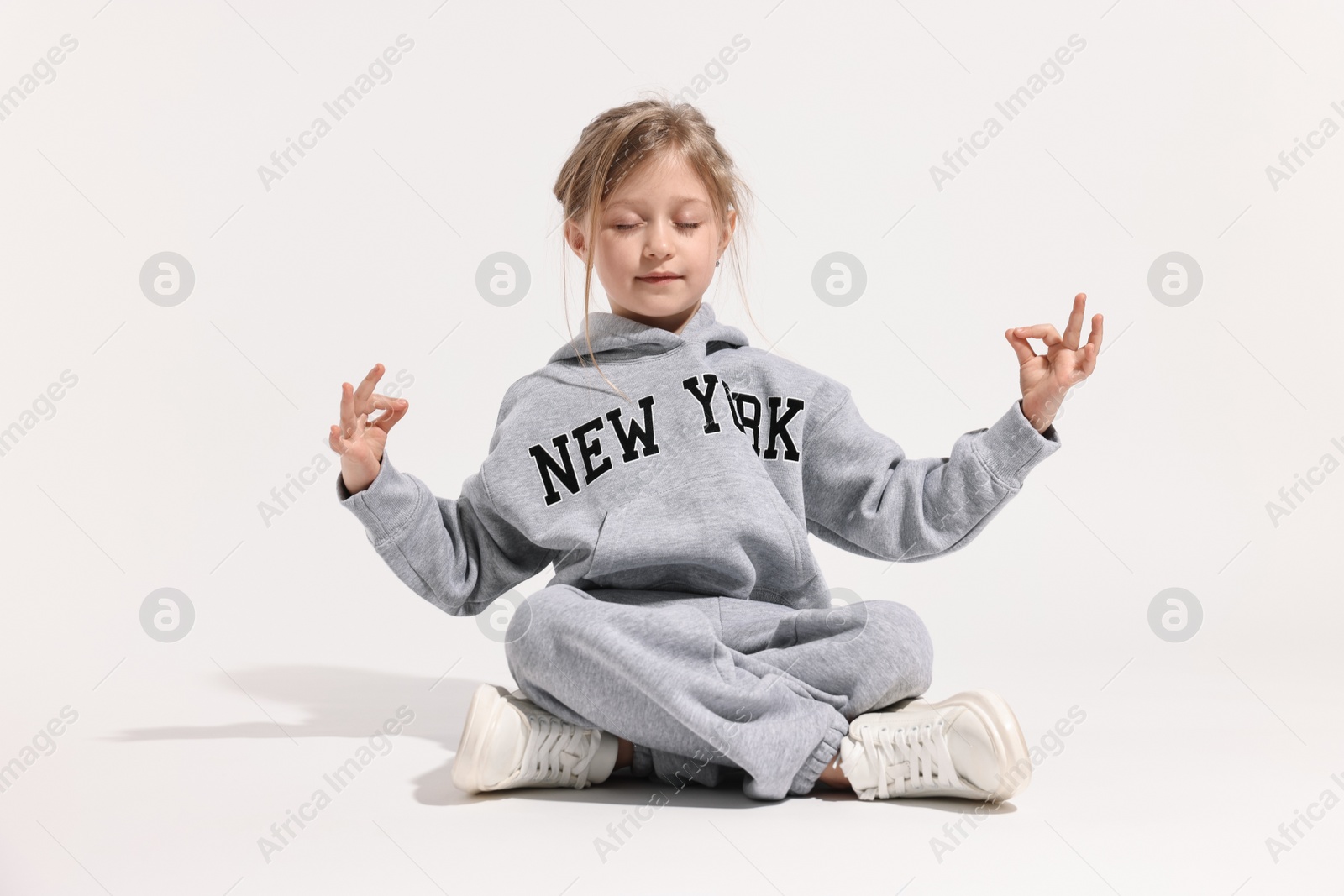 Photo of Fashion concept. Stylish girl posing on white background