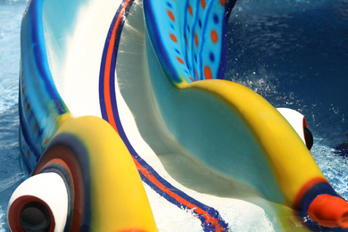Photo of Children's slide in water park. Summer vacation