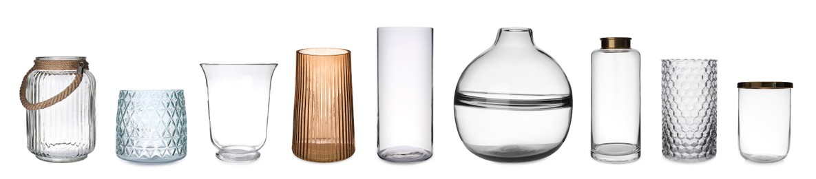 Image of Set of different stylish glass vases on white background