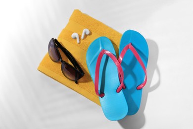 Photo of Flat lay composition with beach accessories on white background
