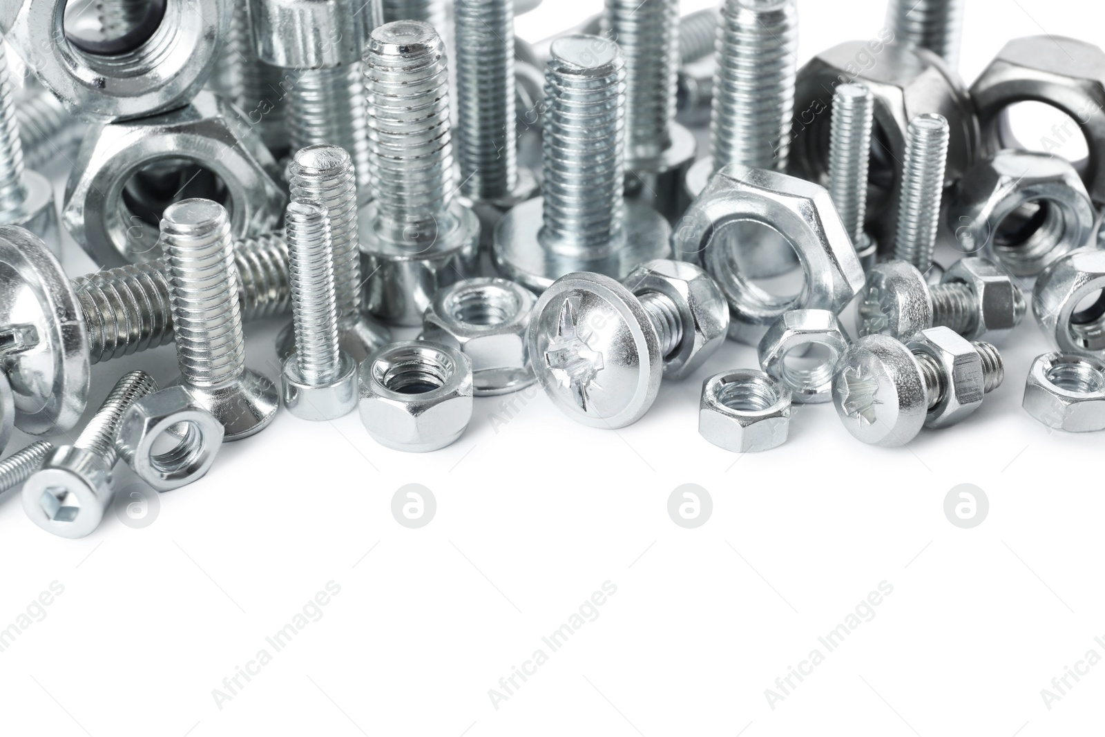 Photo of Different metal bolts and nuts on white background