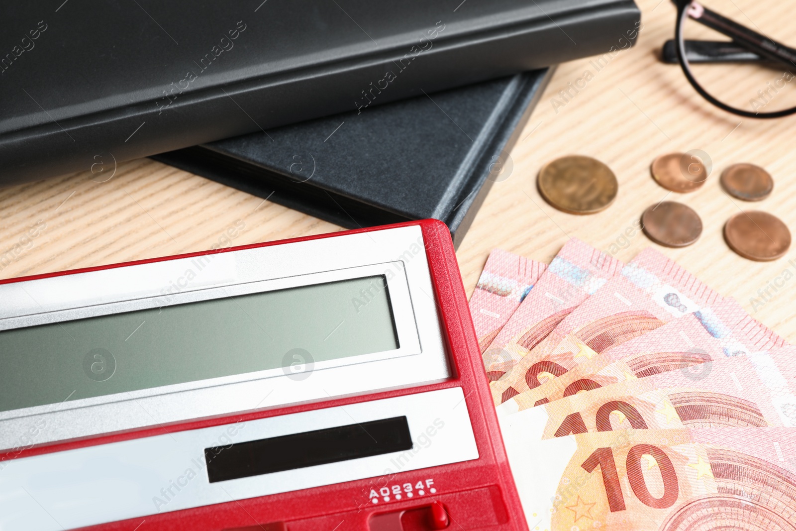 Photo of Calculator and money on wooden background, closeup. Tax accounting