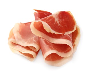 Slices of delicious jamon on white background