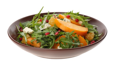 Photo of Delicious persimmon salad with blue cheese and pomegranate isolated on white