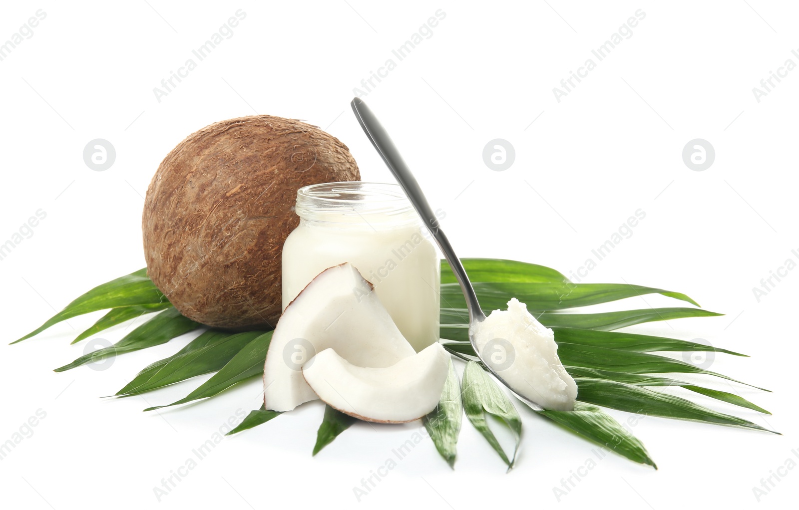 Photo of Beautiful composition with coconut oil and nuts on white background