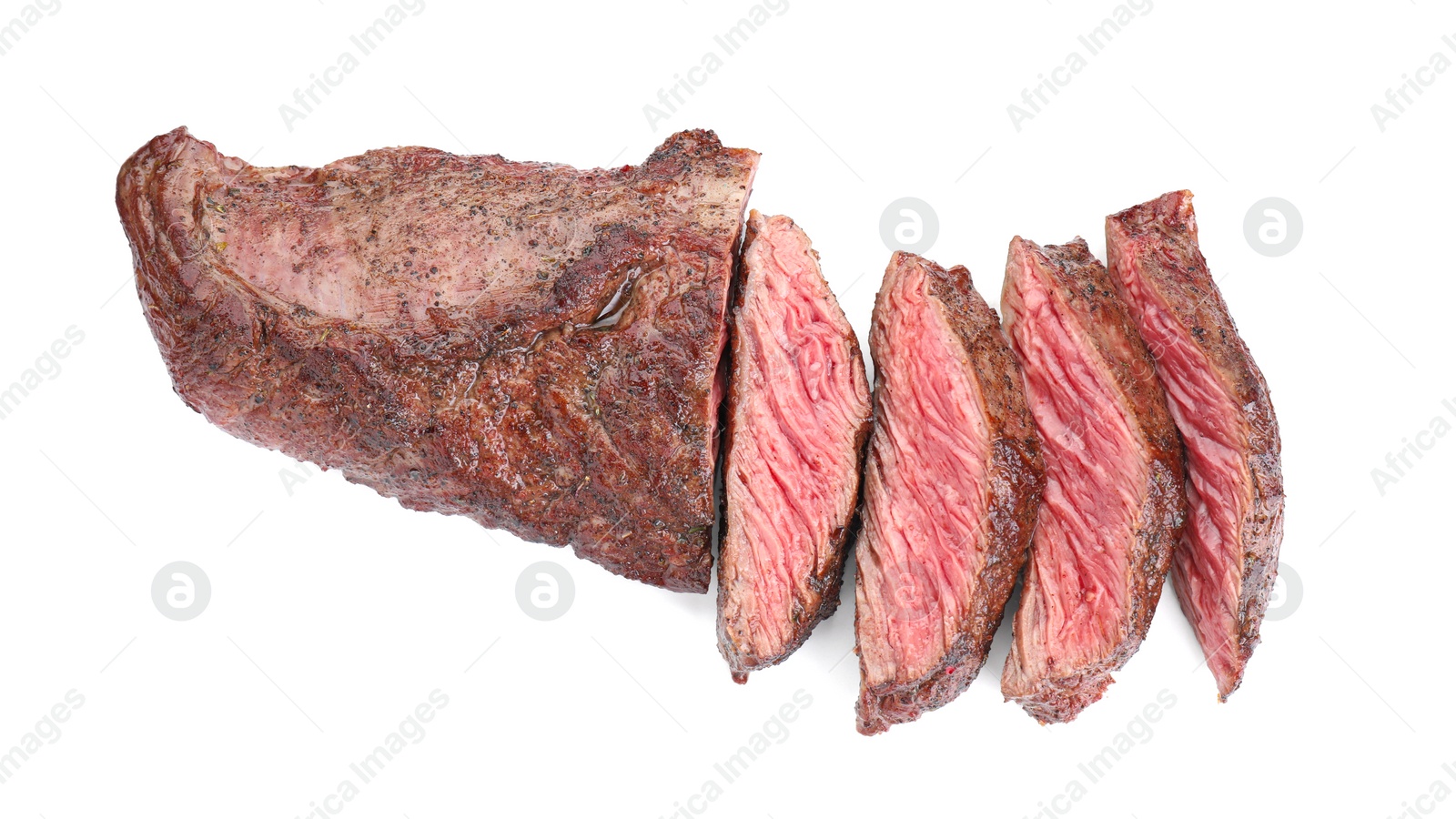 Photo of Pieces of tasty grilled beef meat isolated on white, top view