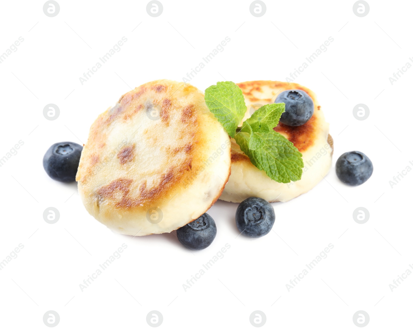 Photo of Delicious cottage cheese pancakes with blueberries and mint isolated on white