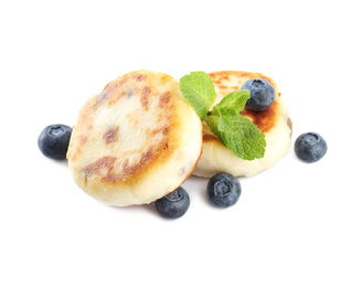 Photo of Delicious cottage cheese pancakes with blueberries and mint isolated on white