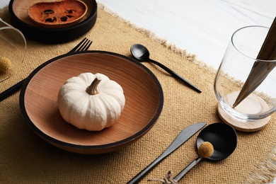 Autumn table setting with pumpkin on white background