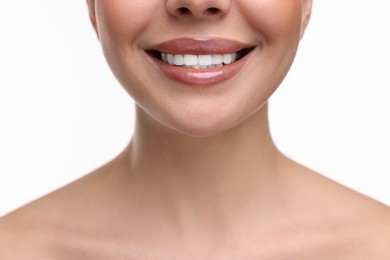 Woman with beautiful lips smiling on white background, closeup