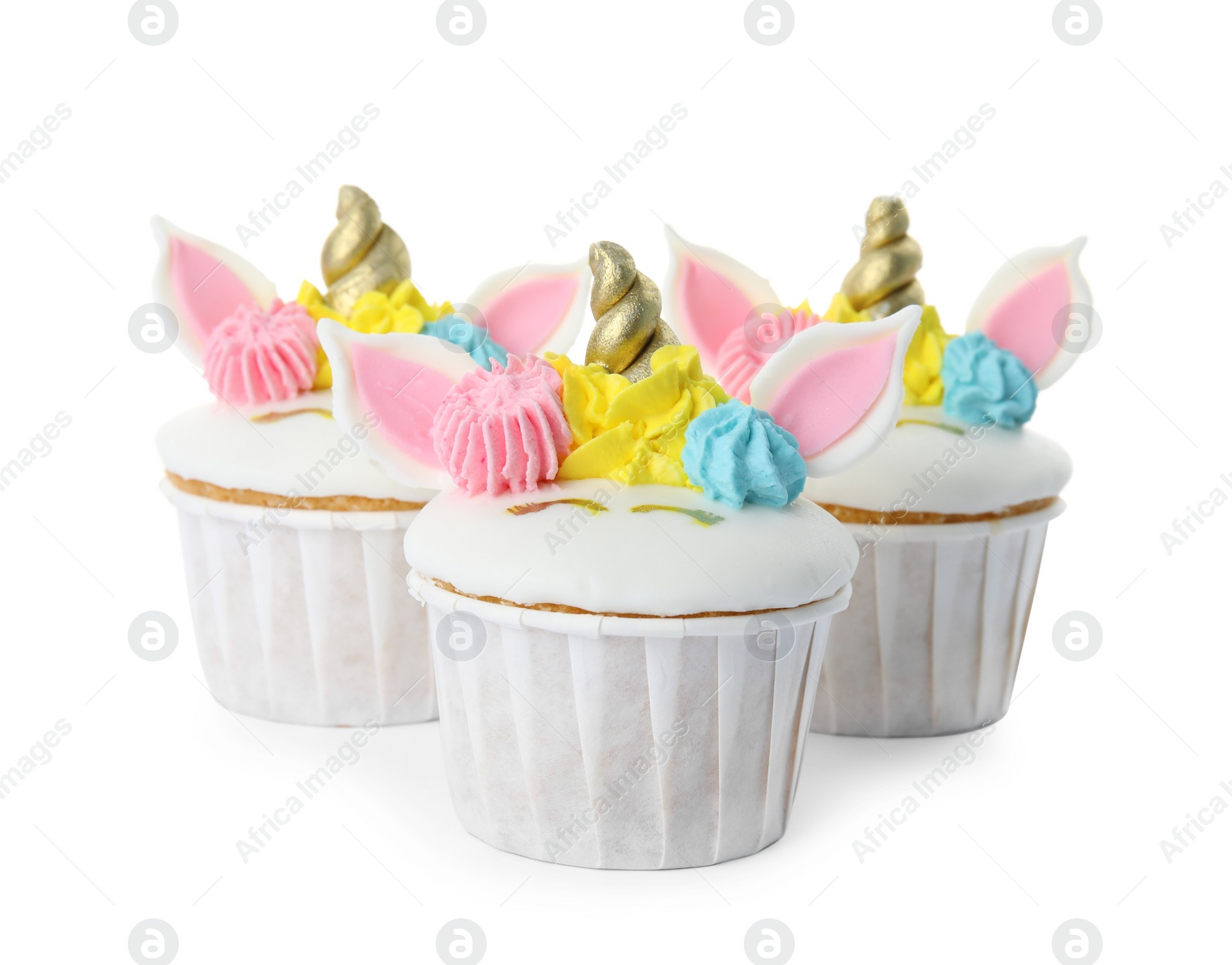 Photo of Three cute sweet unicorn cupcakes on white background