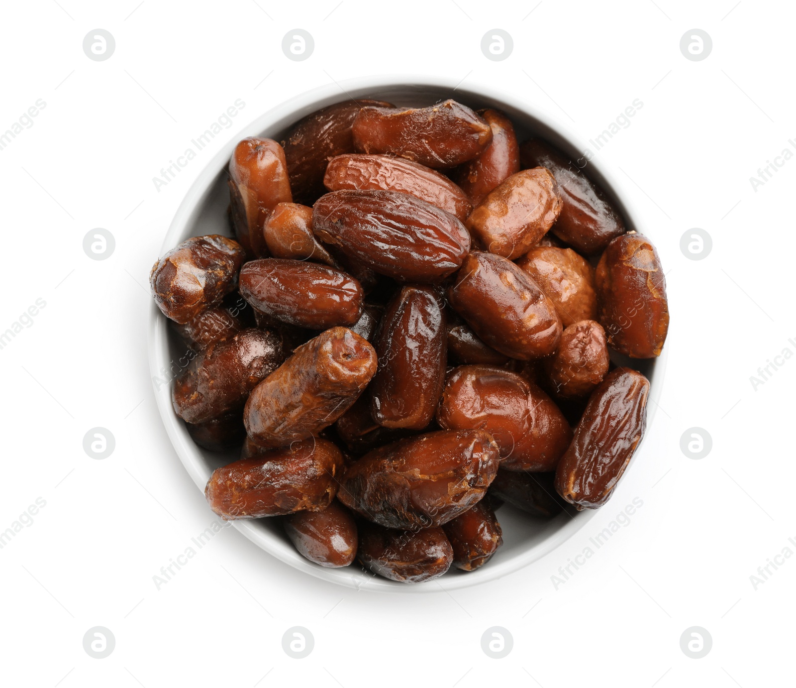 Photo of Bowl with sweet dried date fruits isolated on white, top view