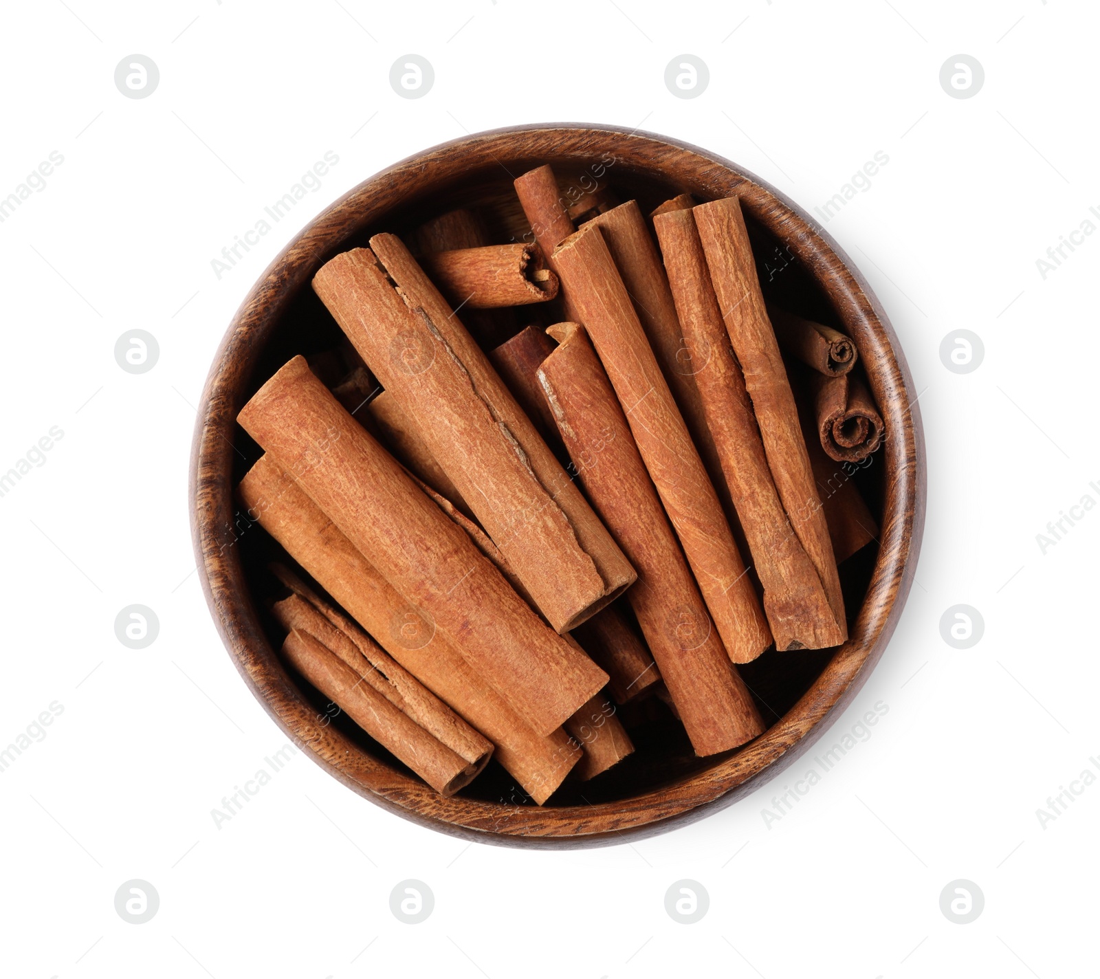 Photo of Cinnamon sticks in bowl isolated on white, top view