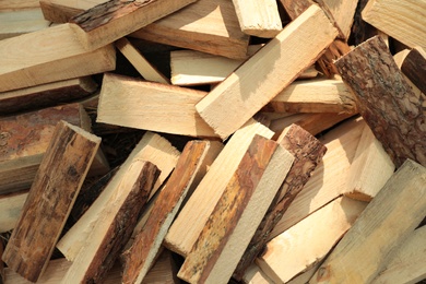 Photo of Pile of cut firewood as background, top view