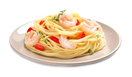 Plate with spaghetti and shrimps on white background