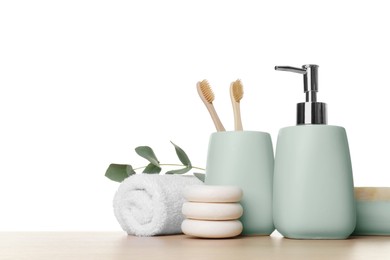 Bath accessories. Different personal care products and eucalyptus branch on wooden table against white background. Space for text