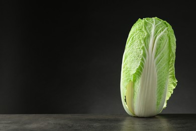 Fresh ripe Chinese cabbage on grey table, space for text