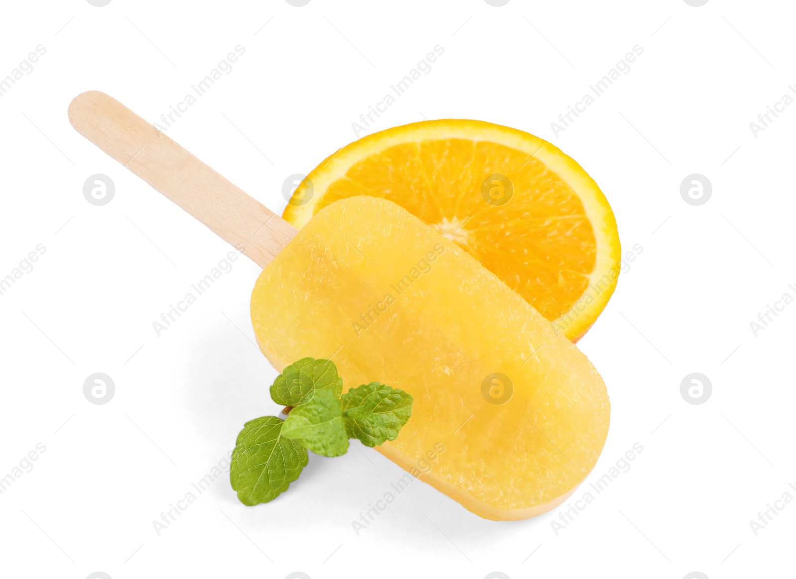 Photo of Tasty orange ice pop and mint isolated on white. Fruit popsicle