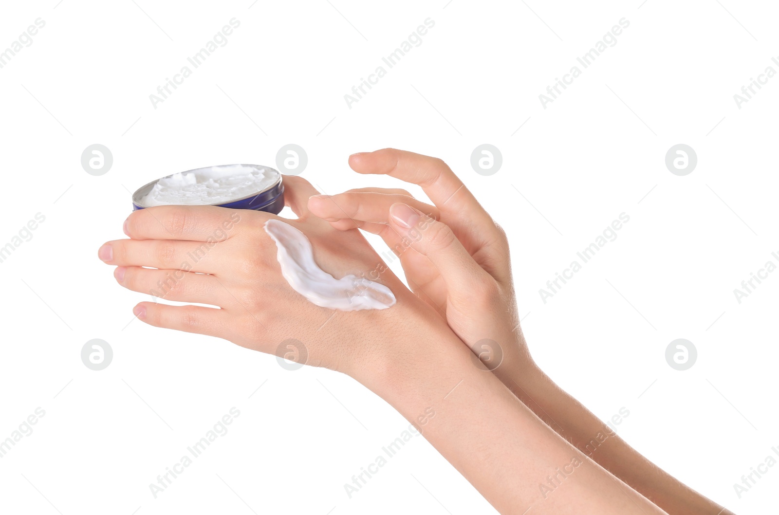 Photo of Young woman applying cream onto her hands on white background, closeup