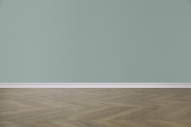 Image of Wooden floor and empty color wall indoors