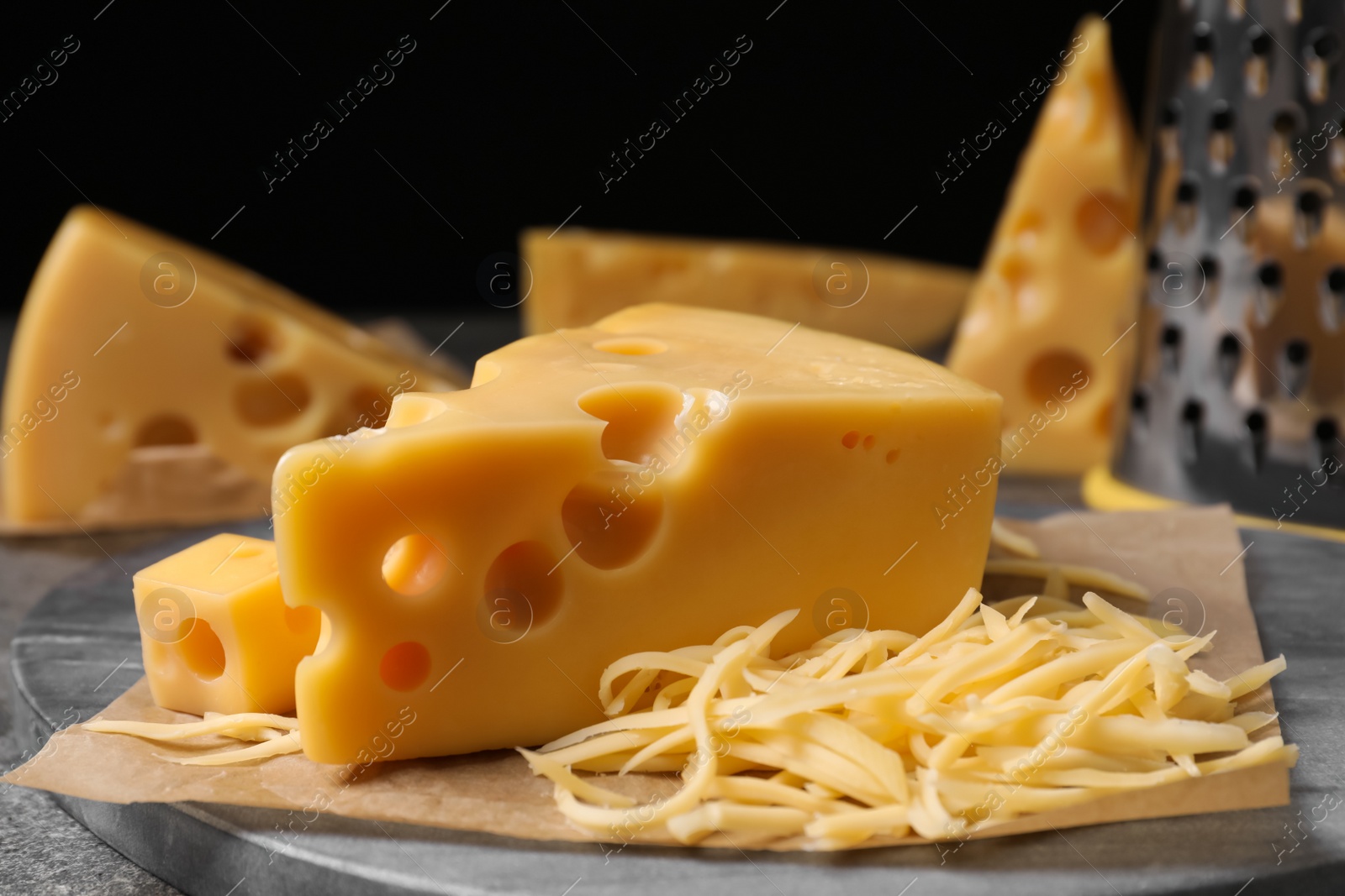 Photo of Tasty fresh cheese on grey table, closeup