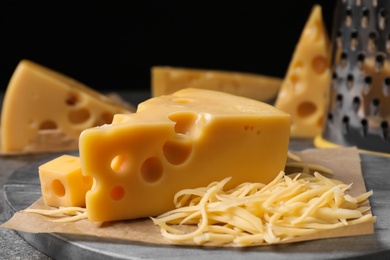 Photo of Tasty fresh cheese on grey table, closeup