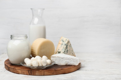 Different dairy products on wooden table