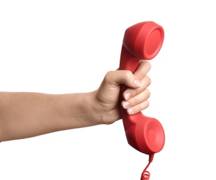 Photo of Woman holding red corded telephone handset on white background, closeup. Hotline concept