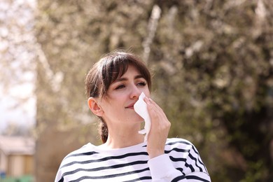 Photo of Woman suffering from seasonal allergy in park